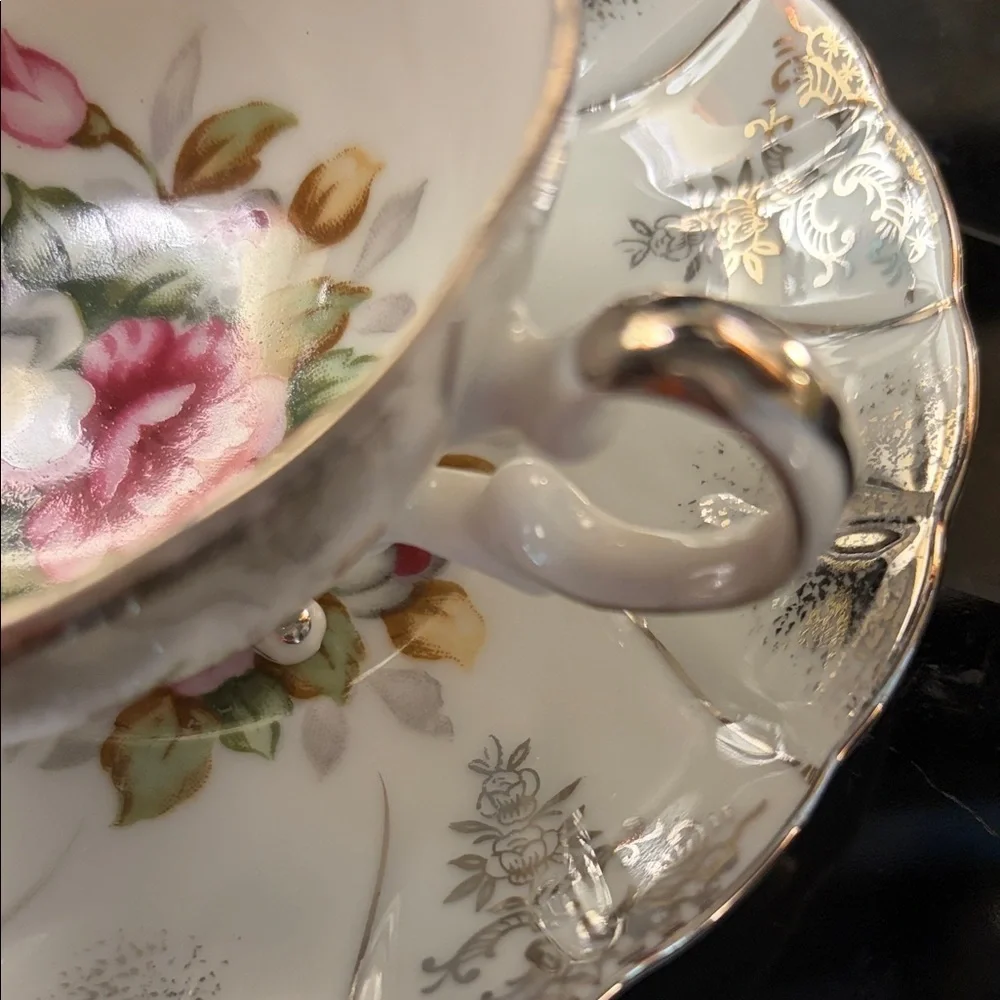 Vintage 3 footed tea cup made in Japan roses with silver guild. Rare!